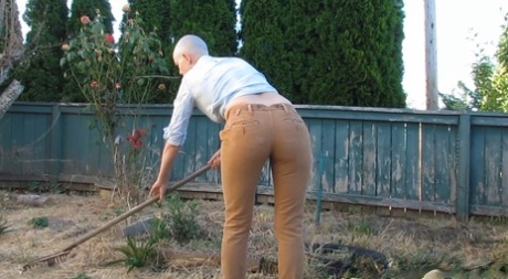 Bald female Abigail Dupree strips and takes a piss while hoeing the garden