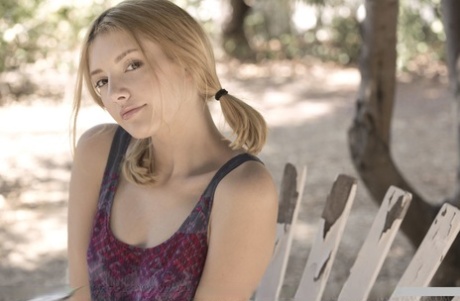 Teen first timer Lena Anderson vaunts her lithe body under a tree outside