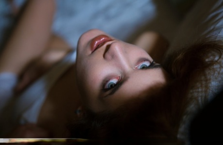 Erotic teen with blue eyes and big puffy nipples posing naked in the shadows
