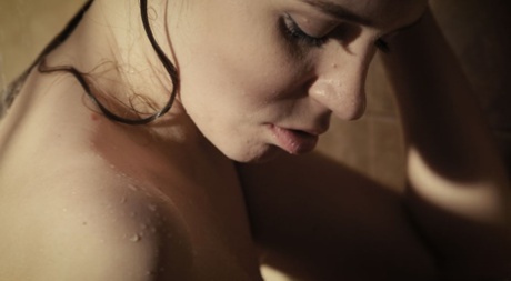 Young beauty Kalisy masturbates with a dildo while in the shower