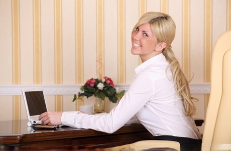 Blonde secretary Amalia C showcases her bald pussy after disrobing after work