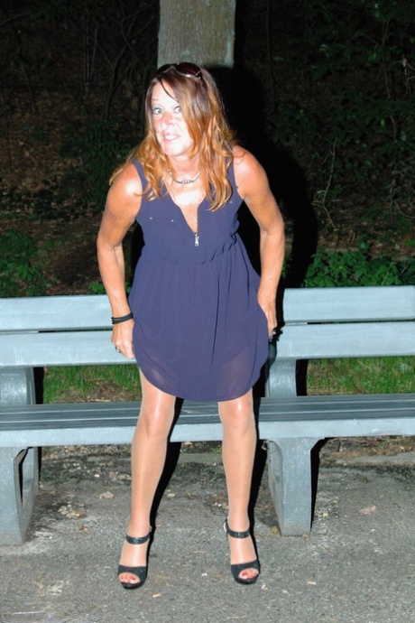 Amateur female pulls down her hose for a piss on park bench at night