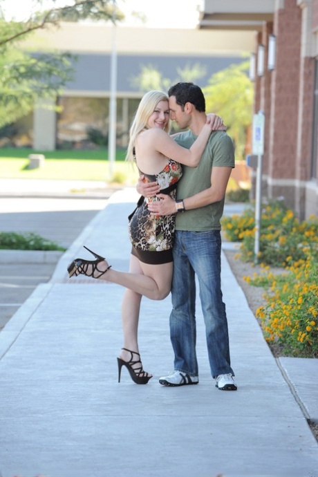 Blonde amateur exposing large boobs and shaved pussy outdoors in high heels