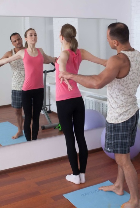 Tall teen Daniela gets banged by her personal trainer on yoga mat