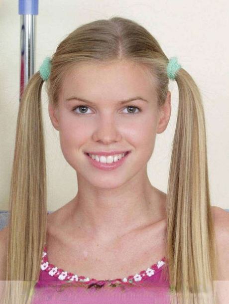 Adorable teen Marketa gets completely naked with her hair in pigtails