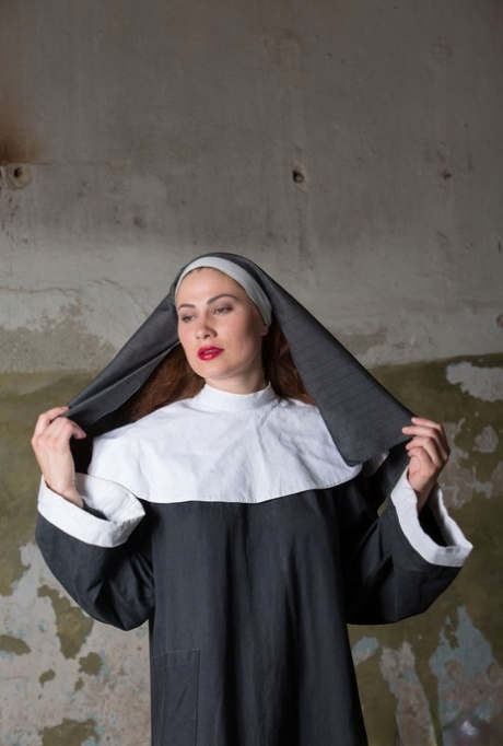 18 year old nun Judith Able removes her clothing to model naked