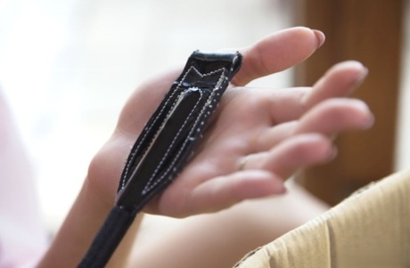 Horny teen Lee Anne teases herself with a riding crop while masturbating