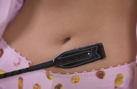Horny teen Lee Anne teases herself with a riding crop while masturbating