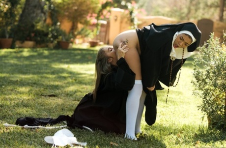 Horny nuns Cassidy Banks and Lena Paul go lesbian out on the lawn