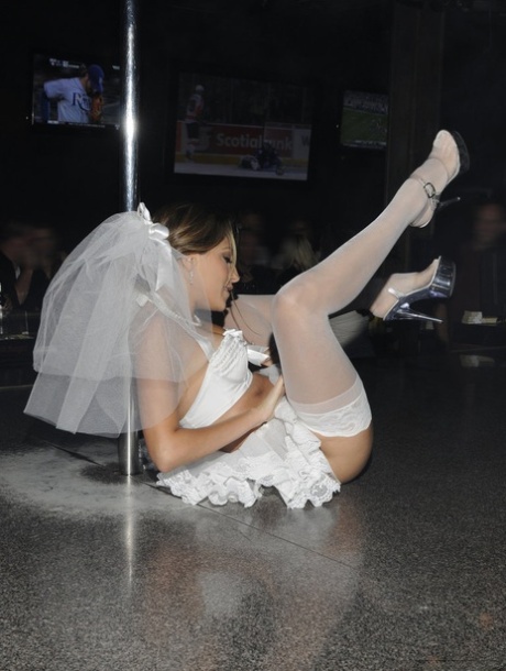 Jenna Haze puts on a show in a strip club while wearing white stockings