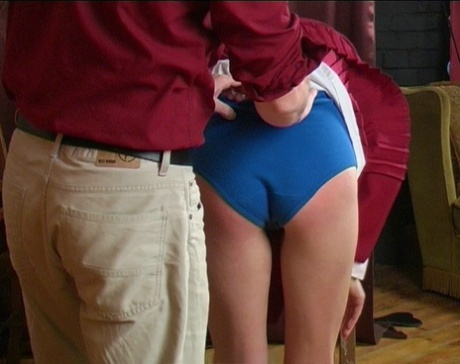 Blonde student has her ass turned bright red by her schoolteacher