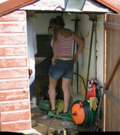 Caucasian girl is taken into a shed for a much-needed spanking