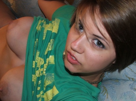 Young looking amateur takes self shots of her big natural boobs