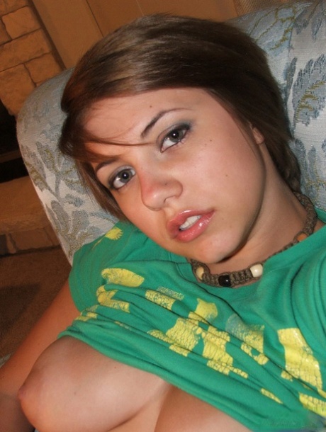 Young looking amateur takes self shots of her big natural boobs