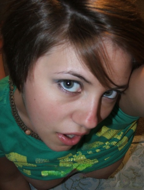 Young looking amateur takes self shots of her big natural boobs