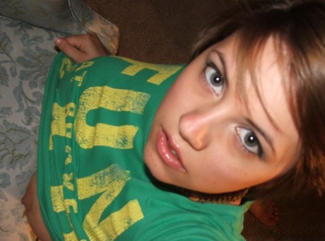 Young looking amateur takes self shots of her big natural boobs