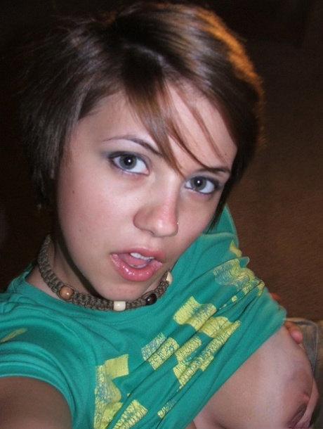 Young looking amateur takes self shots of her big natural boobs