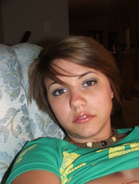 Young looking amateur takes self shots of her big natural boobs