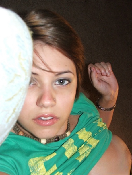Young looking amateur takes self shots of her big natural boobs