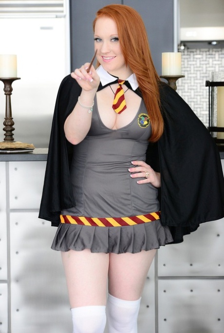 Pale redhead Lucy OHara plungers her fingers into her pussy on kitchen floor