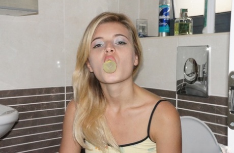 Young cutie Zoey Ryder bares her tiny tits and blows bubbles on the toilet