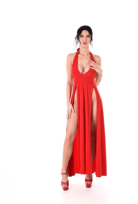 Dark-haired beauty removes a revealing red dress before toying her asshole
