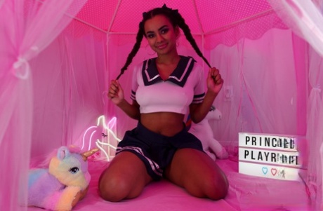 Asian hottie Numi Zarah tugs on her braided pigtails before getting naked