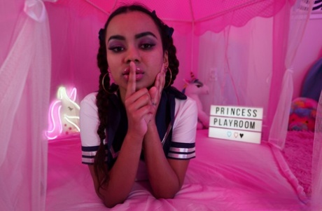 Asian hottie Numi Zarah tugs on her braided pigtails before getting naked