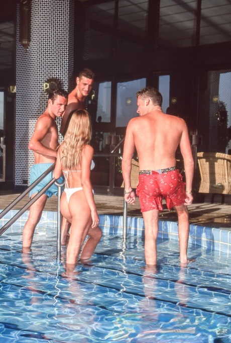 Beautiful girl Nikky Andersson loses her white bikini during a gangbang