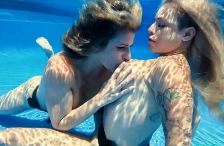 Cory Chase and Lory Lace have underwater lesbian sex in a public pool