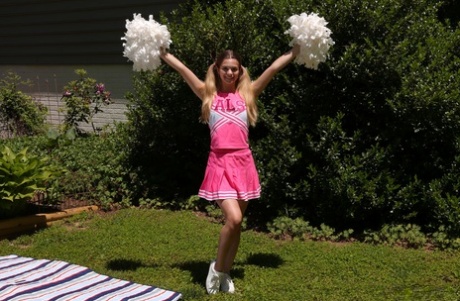 Teen cheerleader Molly Little gives a cheer before vaginal play