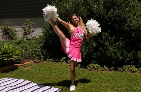 Teen cheerleader Molly Little gives a cheer before vaginal play