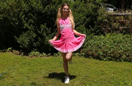 Teen cheerleader Molly Little gives a cheer before vaginal play