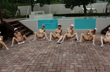 Japanese chicks rub their naked pussies during a game of Simon says