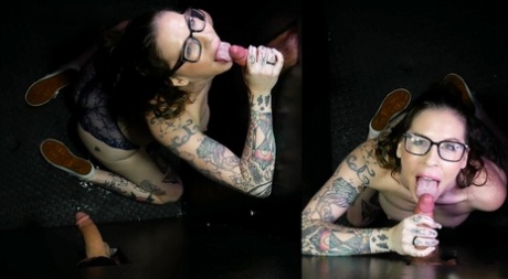 Tattooed brunette Nikki Zee sucks off a bunch of cocks at a gloryhole