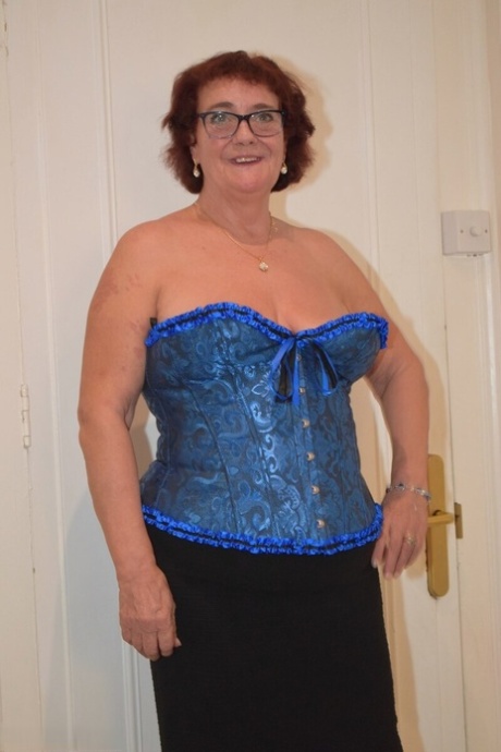Overweight granny Phillipas Ladies undoes her bustier during solo action