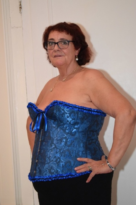 Overweight granny Phillipas Ladies undoes her bustier during solo action
