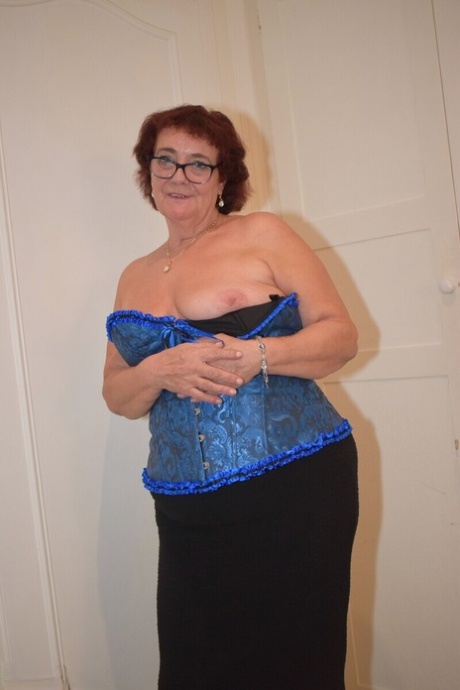 Overweight granny Phillipas Ladies undoes her bustier during solo action
