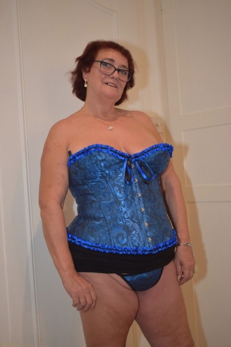 Overweight granny Phillipas Ladies undoes her bustier during solo action