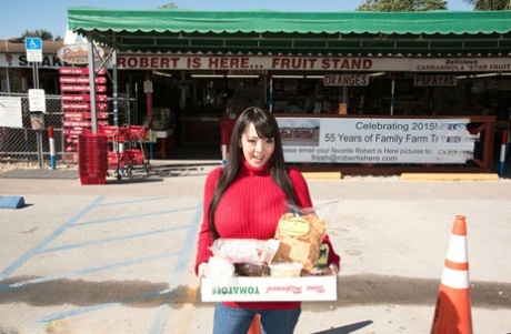 Asian girl with long hair Hitomi fills out her red sweater in non nude action