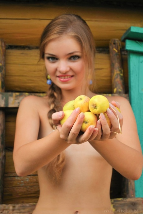 Beautiful petite teen Bridgit uncovers her dripping wet pussy