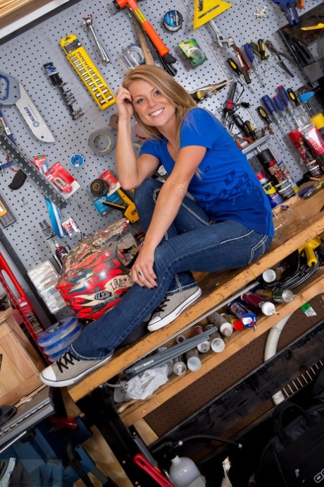 Non nude amateur model Madden in jeans flashing lace panties in the workshop