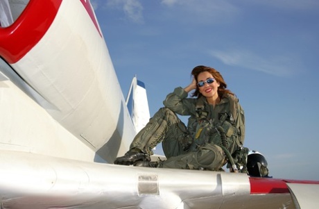 Skillful pilot Roni showing her big boobs and shaved pussy on her plane