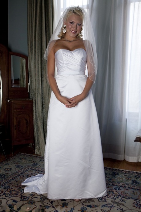 Blonde bride Katie Summers doffs her wedding dress & poses topless in lingerie