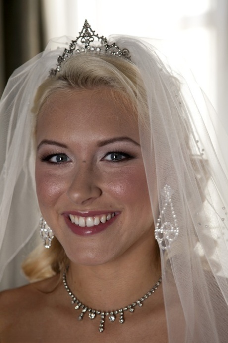 Blonde bride Katie Summers doffs her wedding dress & poses topless in lingerie