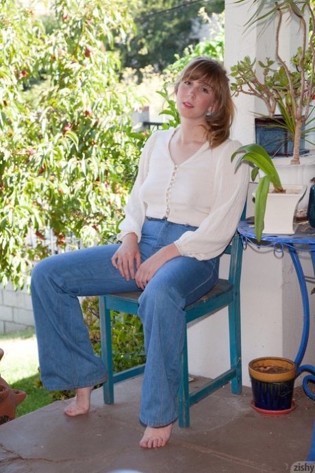Amateur model Tilly Hannon poses non nude on porch before removing blue jeans