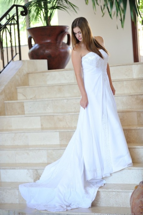 Busty glamorous amateur Danielle models wedding gown indoors & by the pool