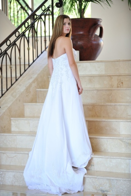 Busty glamorous amateur Danielle models wedding gown indoors & by the pool
