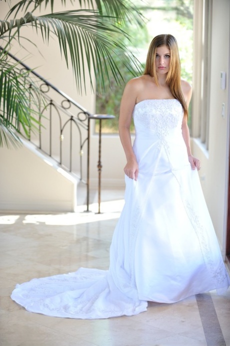 Busty glamorous amateur Danielle models wedding gown indoors & by the pool