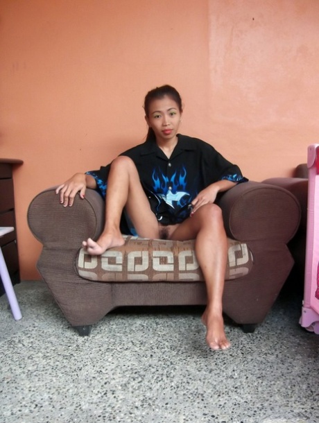 Tiny Filipina girl Ashley poses her tight ass in the nude for a sex tourist
